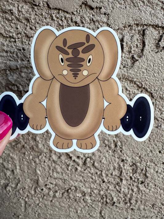 Cartoon brown chracter cutout with dumbbells against a textured wall background.