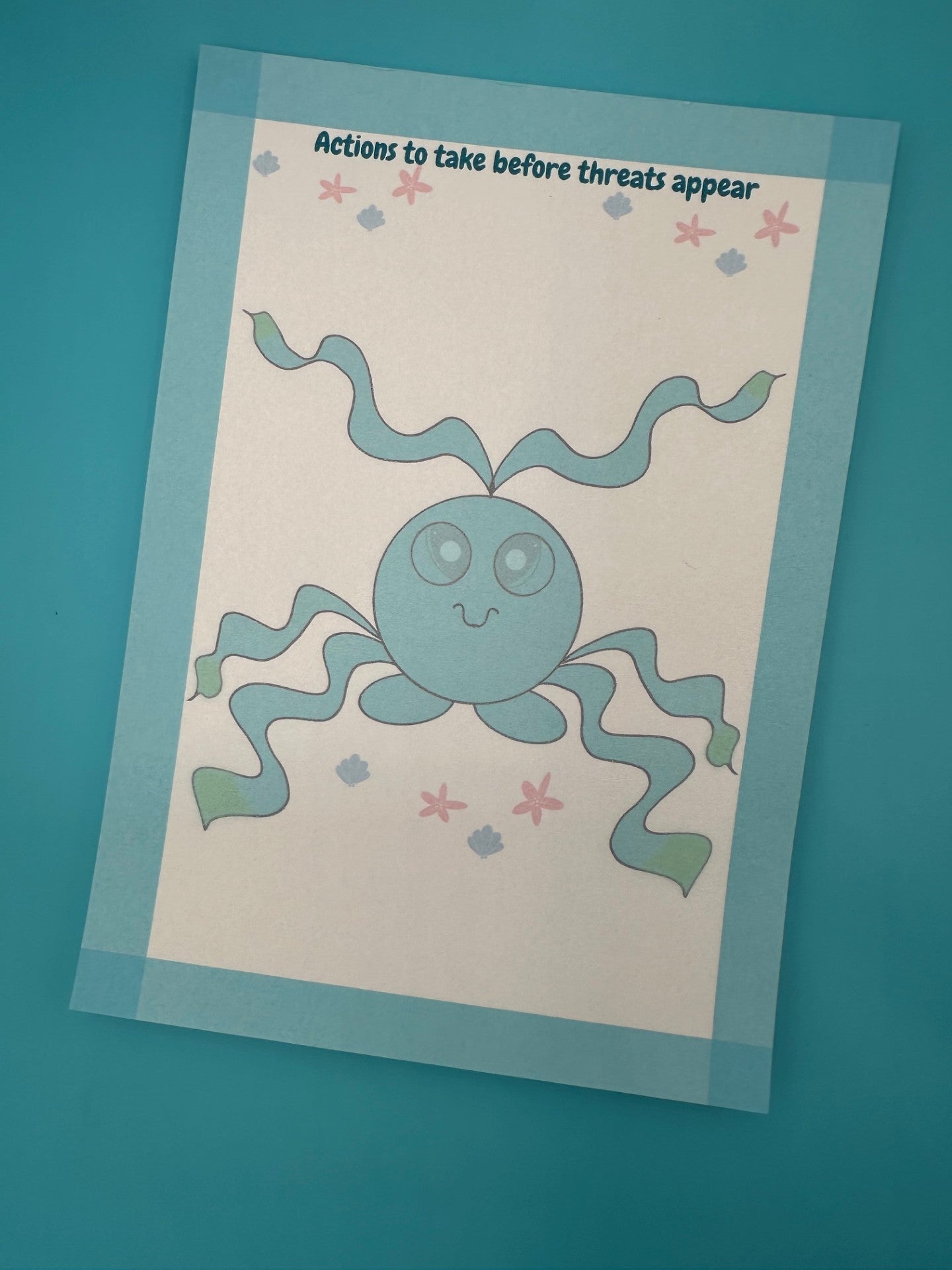 A notepad with a blue shape character that has tentacles coming from it with big blue eyes with shells on the bottom and starfish. Around the edges of the notepad is a blue color with a notepad heading of "Actions to take before threats appear". The notepad is sitting on top of a blue background with a pen.