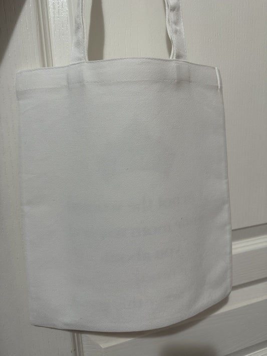 White tote bag on a white background. The back of tote bag.