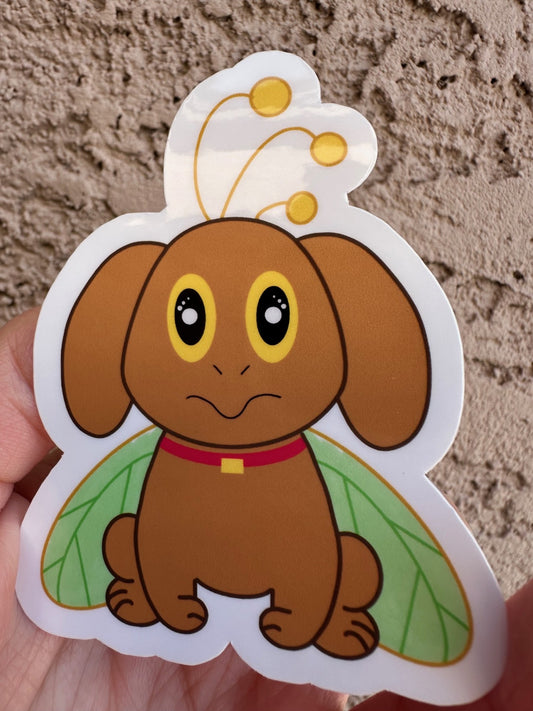 Cartoon brown dog that has big yellow and black eyes with green butterfly wings held against a textured beige background.