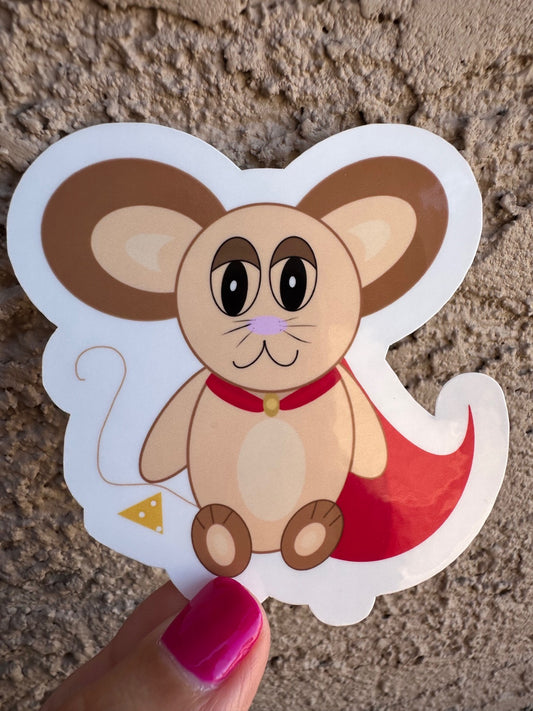 Cartoon mouse sticker held by a hand with pink nail polish on a textured surface.