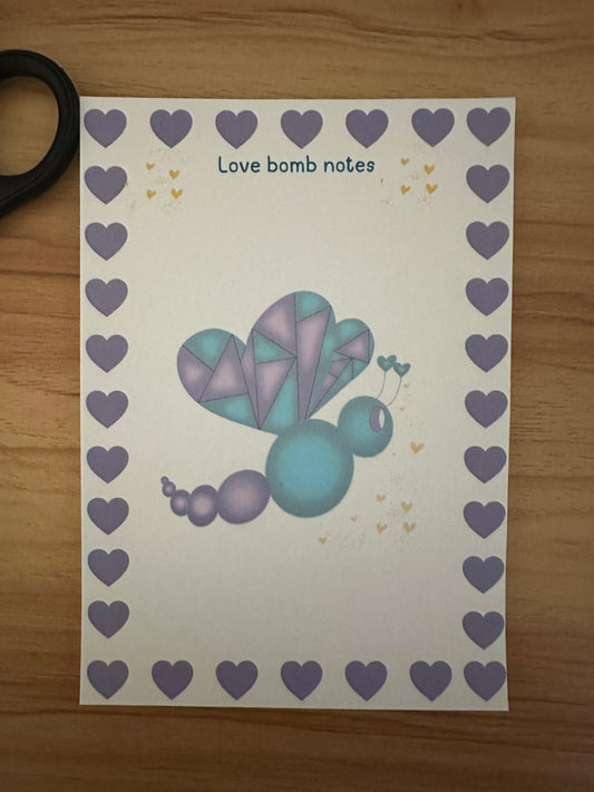 Notepad titled "Love Bomb Notes" features the character Love Mist, which has a purple and deep green color with yellow hearts falling from it.