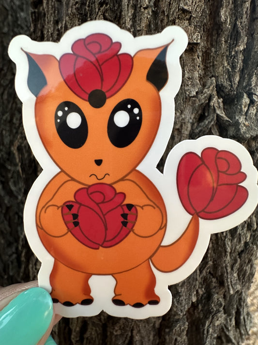Orange cartoon character with red roses against a tree bark background. The character is holding a red rose and has a red rose on top of the head and has one on the tail.